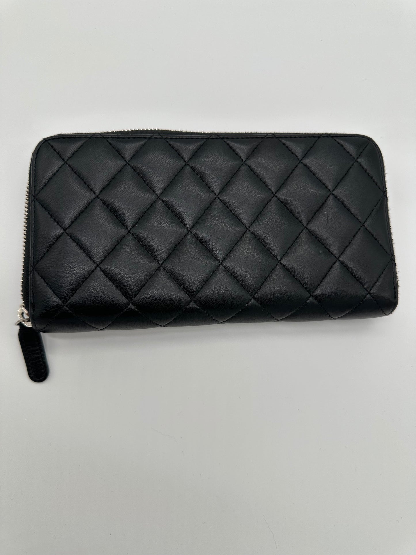 Luxury Soluciens Pre-owned Chanel black long lambskin leather zippy wallet with silver hardware
