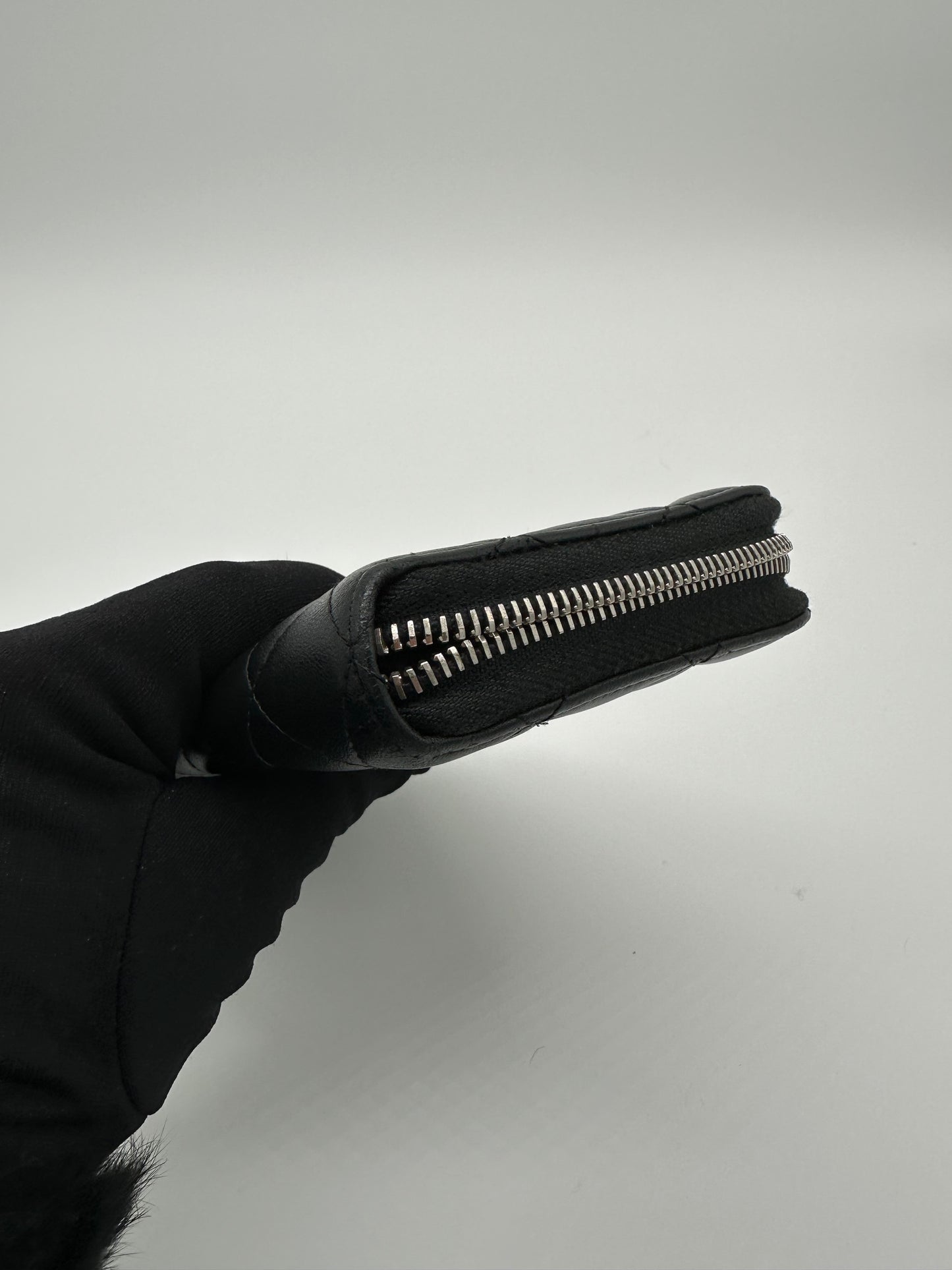 Luxury Soluciens Pre-owned Chanel black long lambskin leather zippy wallet with silver hardware