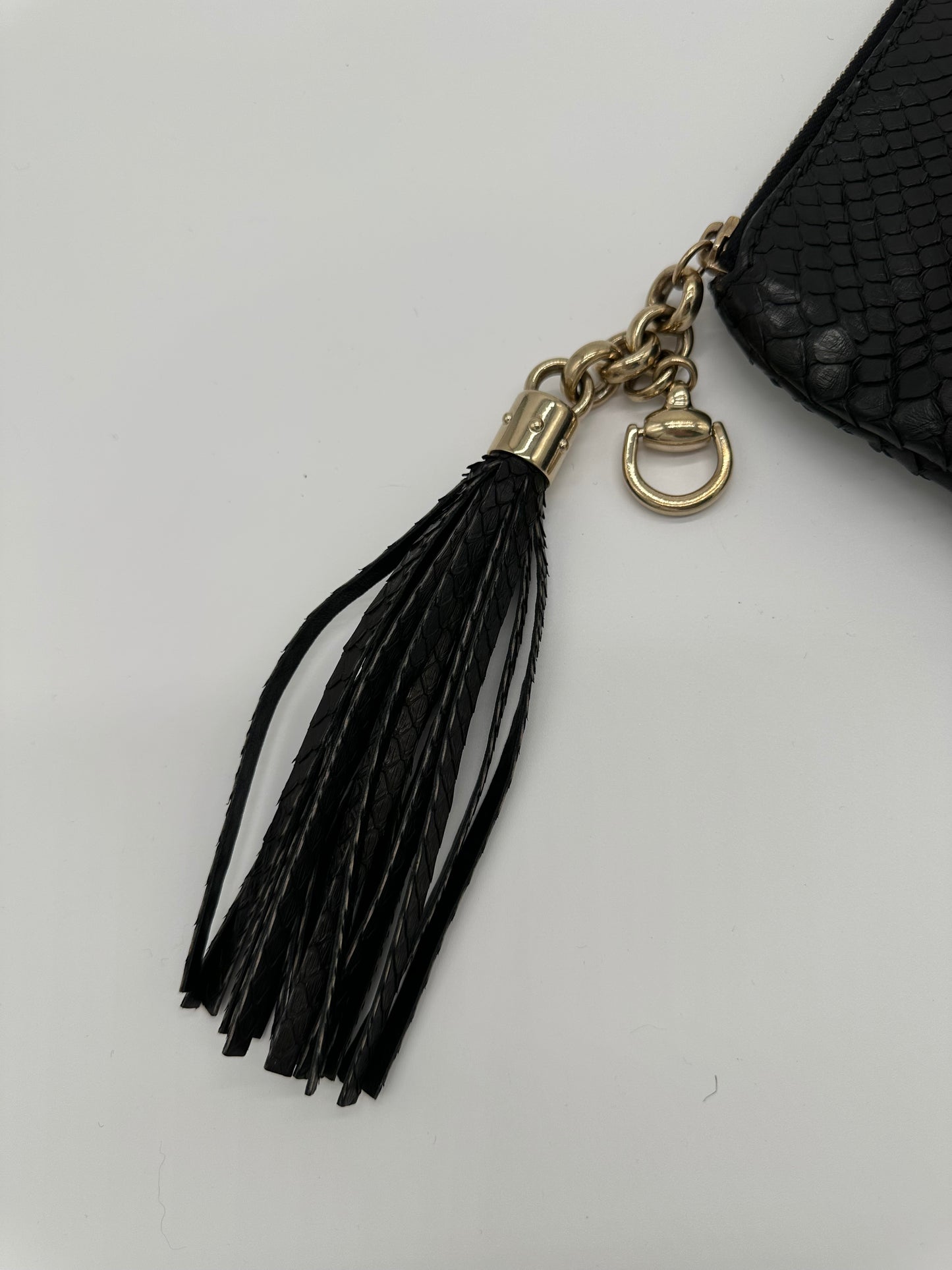 Luxury Soluciens Pre-owned Gucci black python snakeskin clutch, with fringe tassel detail