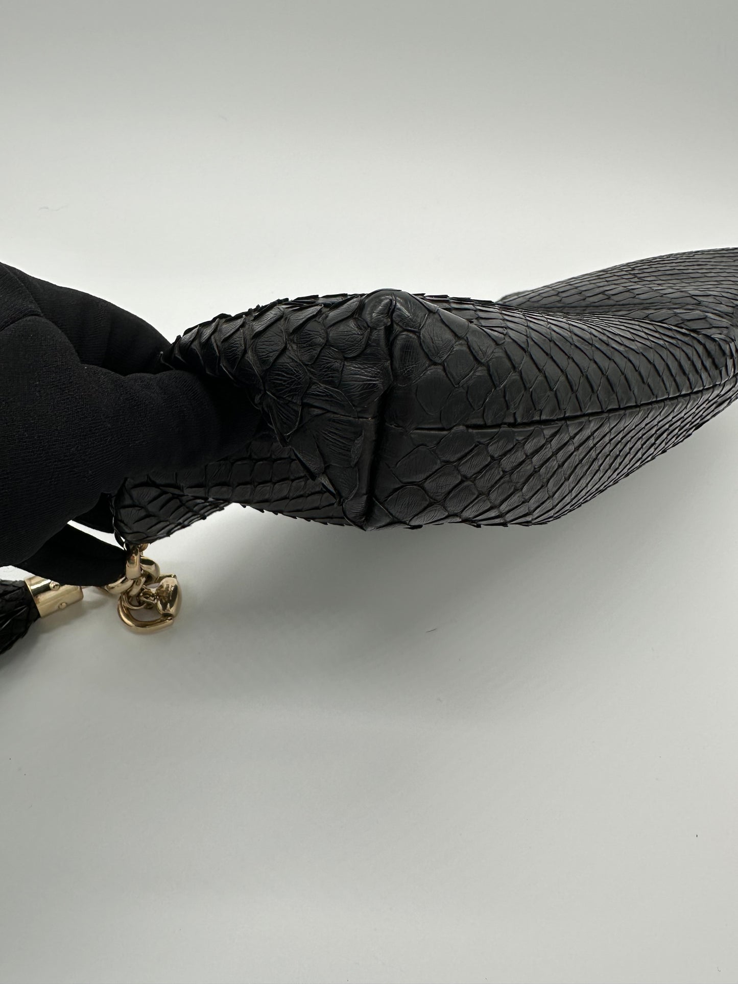 Luxury Soluciens Pre-owned Gucci black python snakeskin clutch, with fringe tassel detail