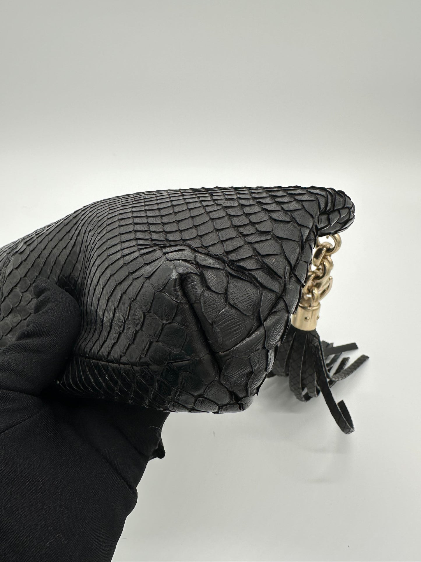 Luxury Soluciens Pre-owned Gucci black python snakeskin clutch, with fringe tassel detail