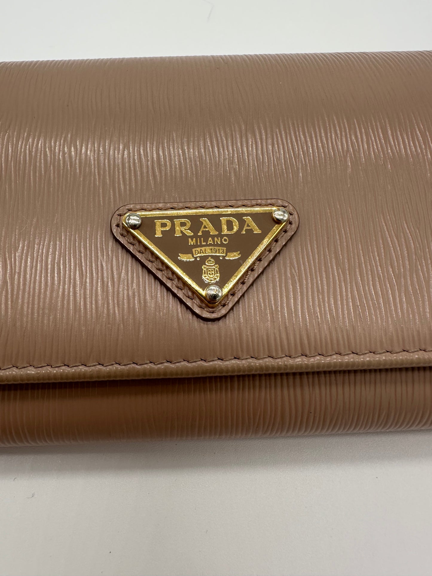 Luxury Soluciens Pre-owned Prada beige grained leather flap wallet