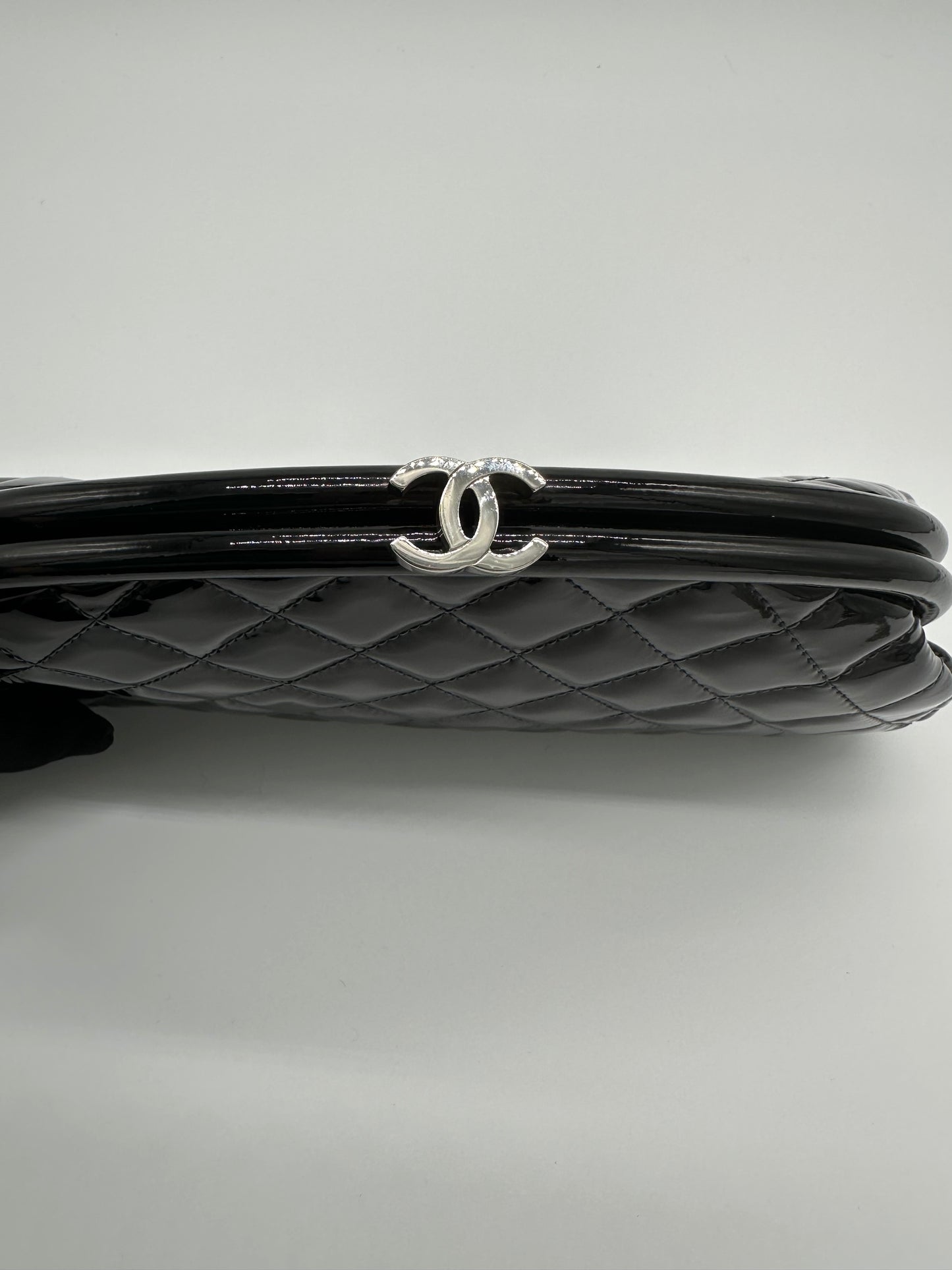 Luxury Soluciens Pre-owned Chanel black patent leather quilted timeless clutch with silver toned hardware