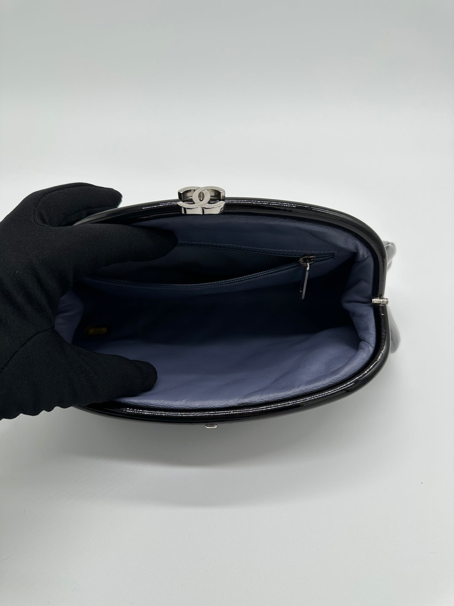Luxury Soluciens Pre-owned Chanel black patent leather quilted timeless clutch with silver toned hardware