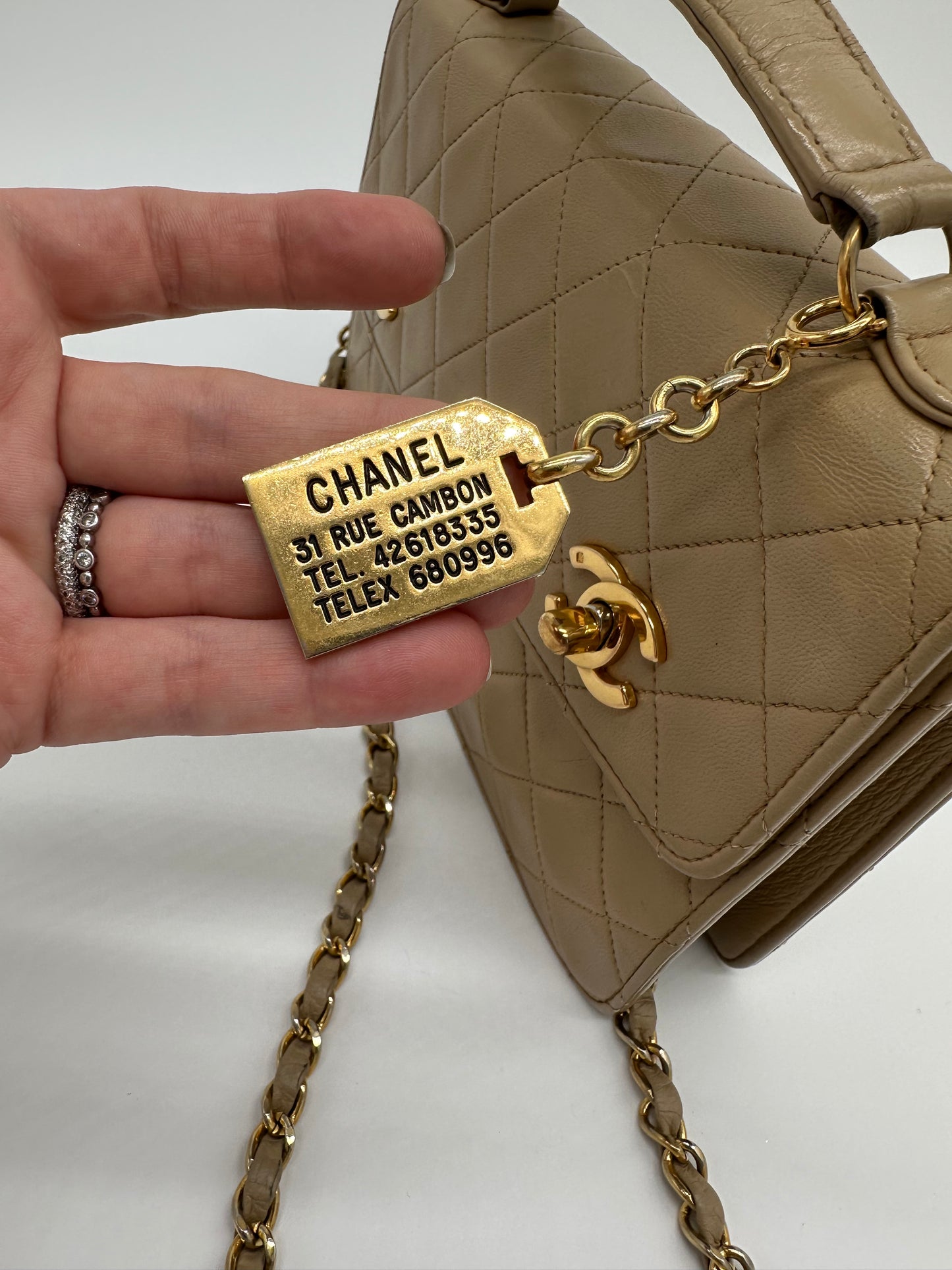 Luxury Soluciens Pre-Owned Vintage Chanel Tan Double Turn Lock Lambskin Leather Bag