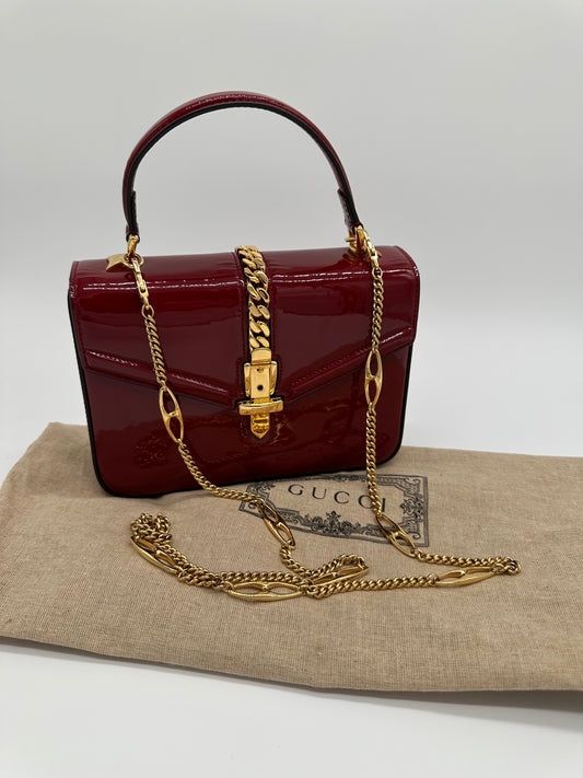 Luxury Soluciens Pre-Owned Gucci Sylvie 1969 Deep Red Patent Leather Bag