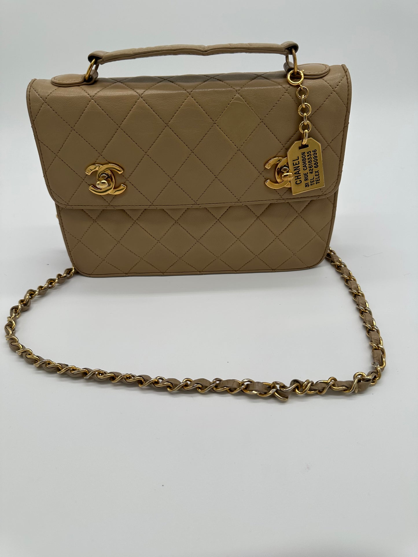 Luxury Soluciens Pre-Owned Vintage Chanel Tan Double Turn Lock Lambskin Leather Bag